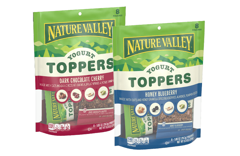 Two front of packs of Nature Valley Yogurt Toppers, Honey Blueberry & Dark Chocolate Cherry, 8 pouches