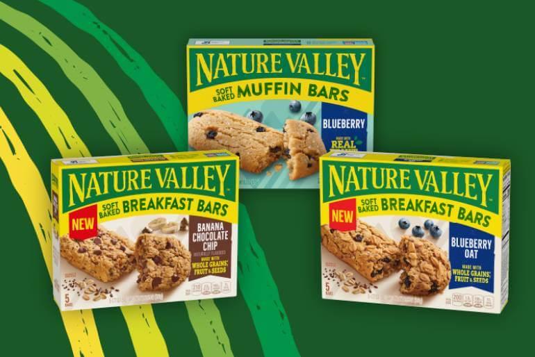 Illustrated graphic showing three boxes of Nature Valley Muffin and Breakfast Bars Boxes. Flavors are: Blueberry, Banana Chocolate Chip and Blueberry Oat, front of 5 bar boxes.